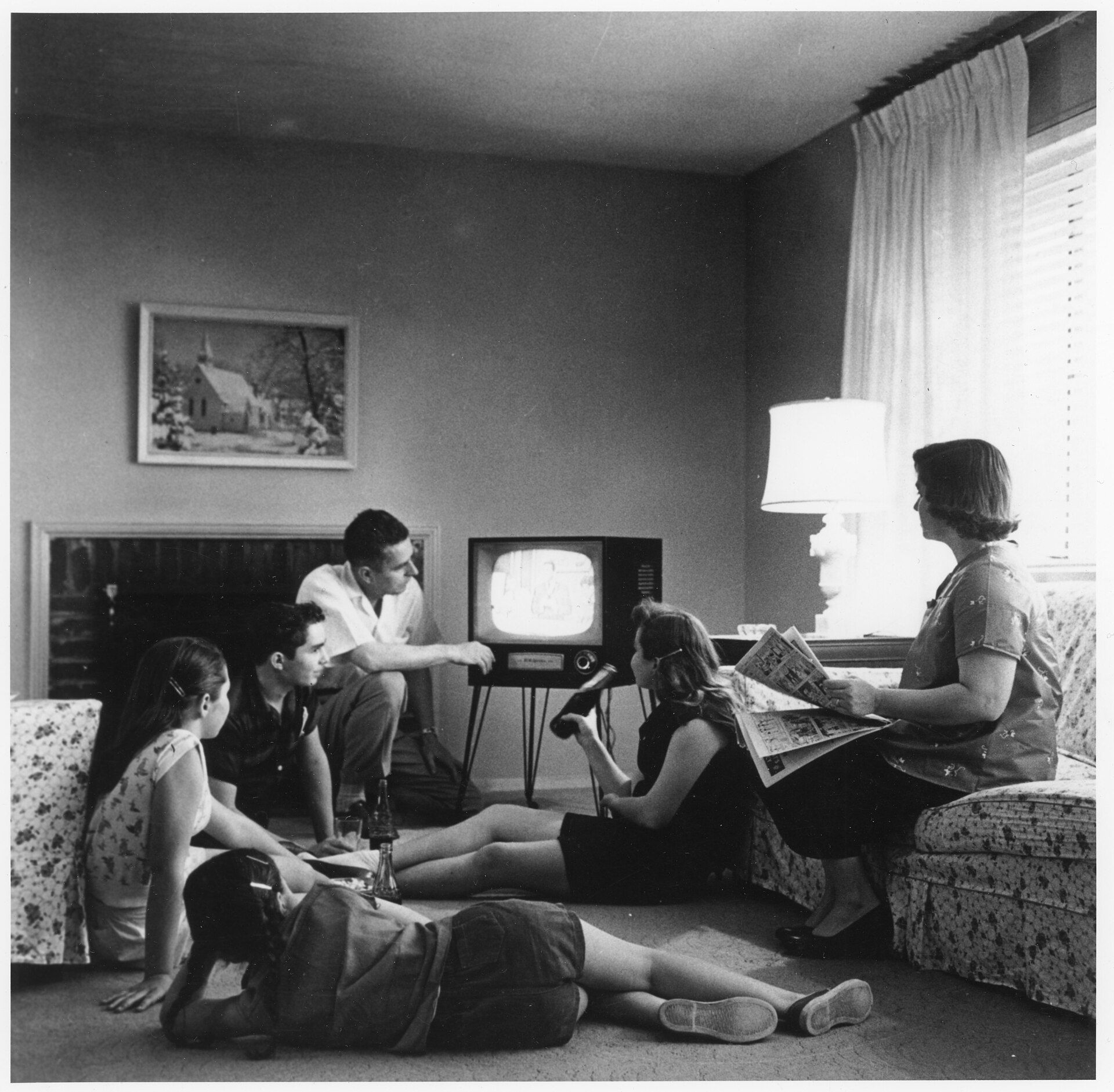 A television glowing in a dark living room (file photo)