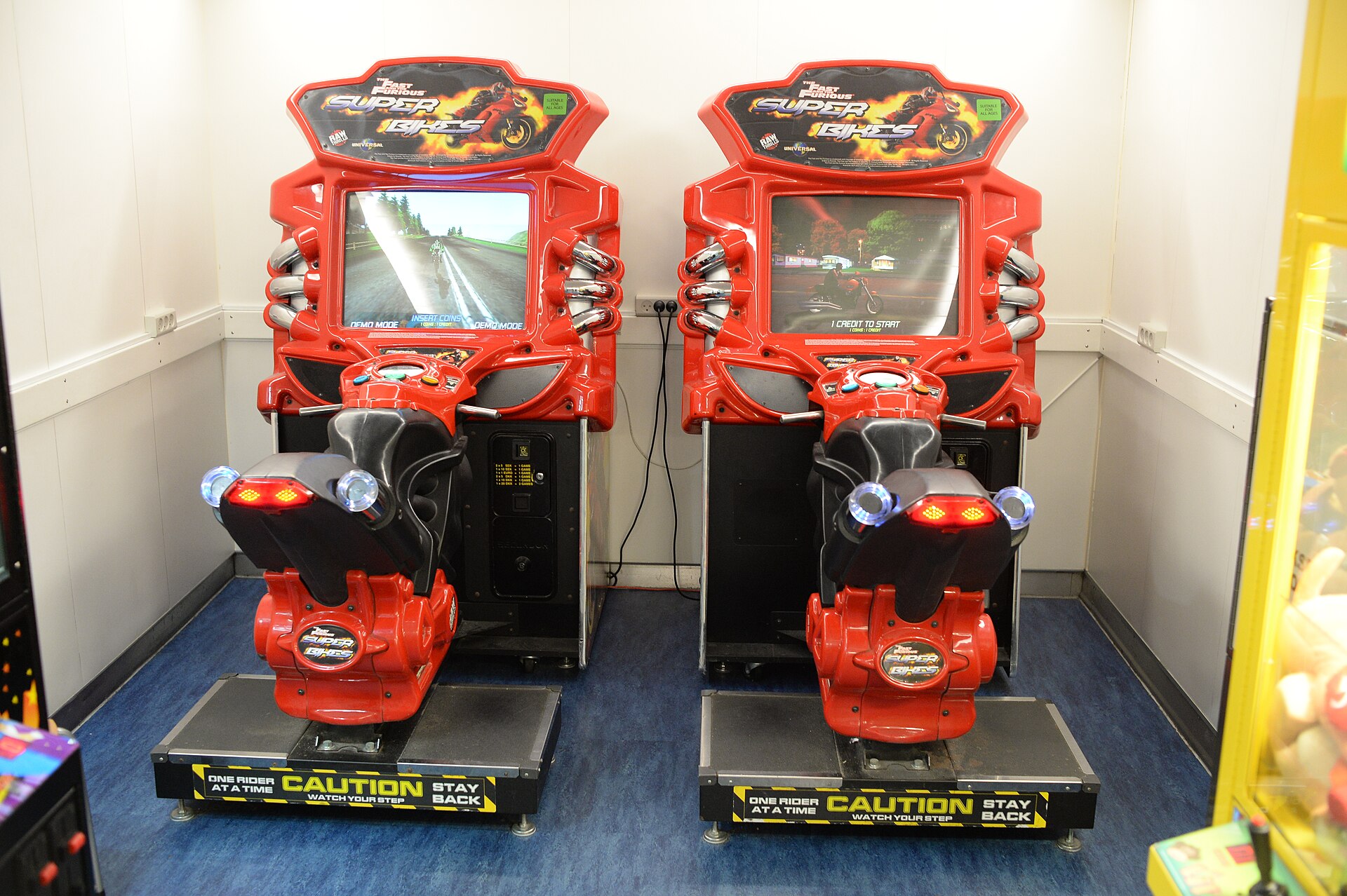 An arcade cabinet glowing in a dark room (file photo)