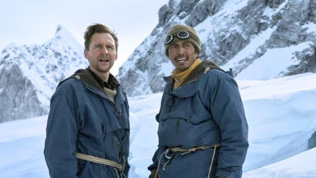 Tom Hiddleston as Edmund Hillary and Genden Phuntsok as Tenzing Norgay roped together on Everest in Tenzing (official key art)