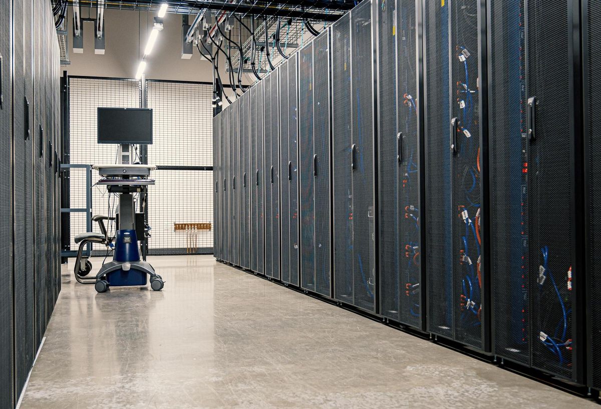 Rows of server racks inside a data center