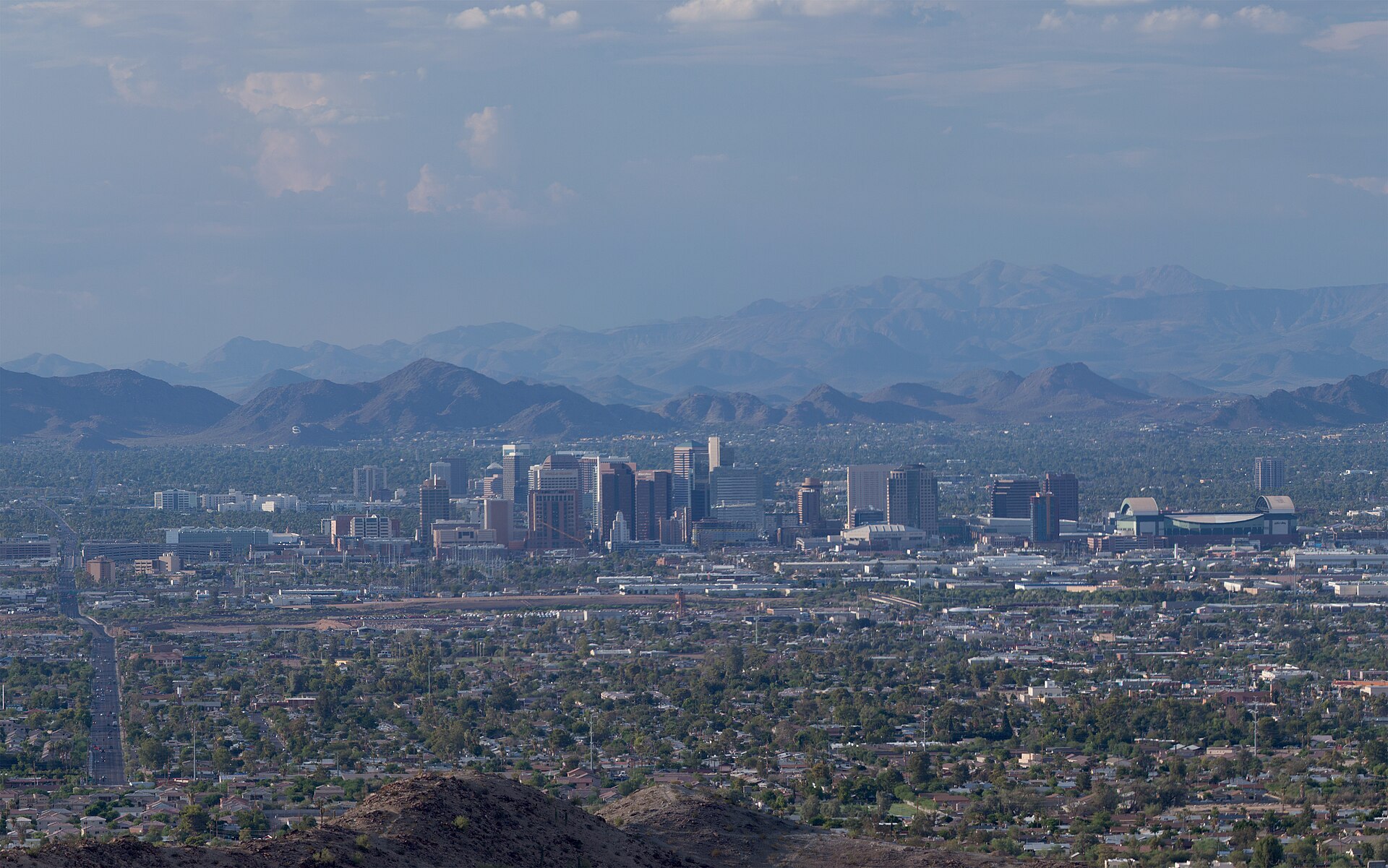 Downtown Phoenix with desert mountains behind it