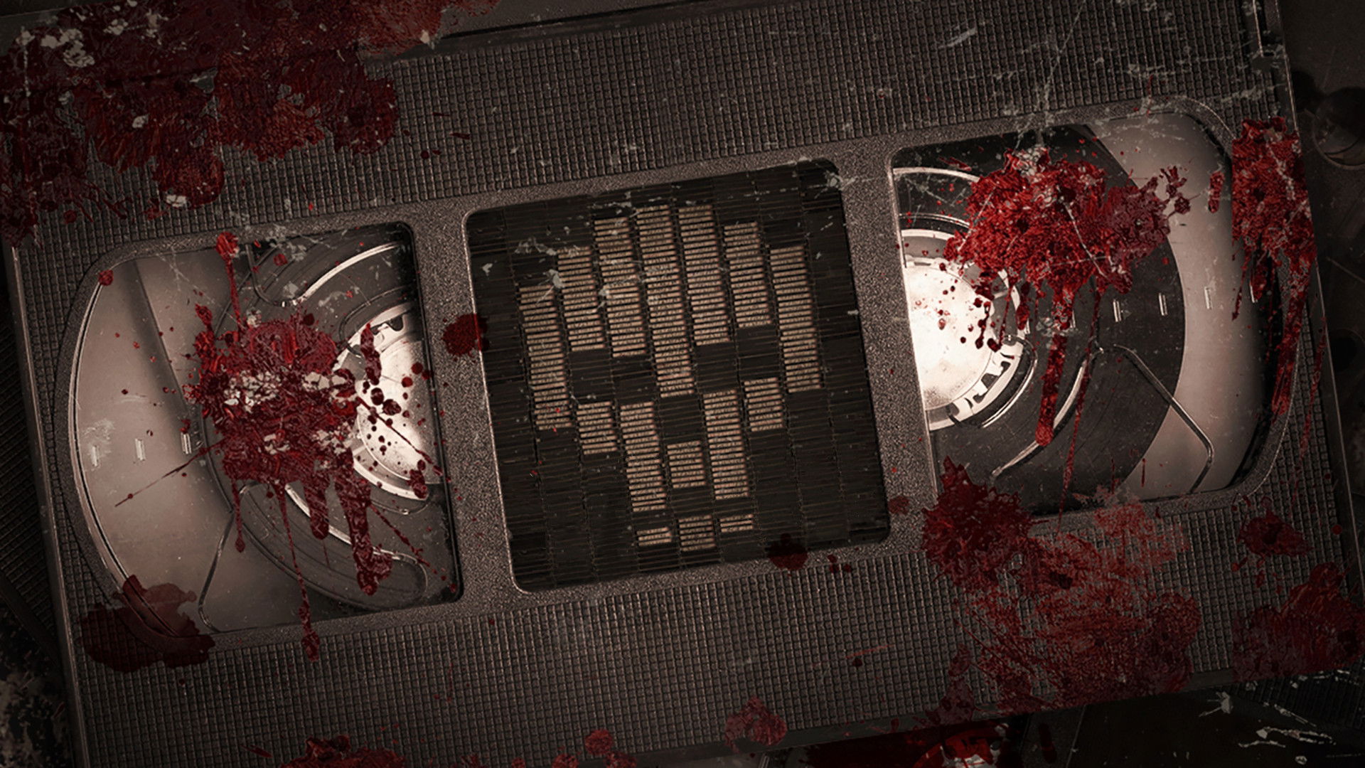 V/H/S/MIXTAPE key art: a blood-splattered VHS tape