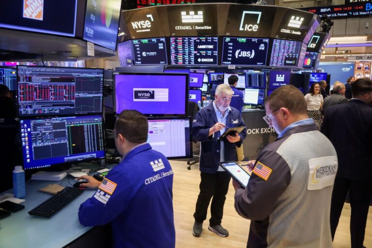 Traders at work on the floor of the New York Stock Exchange