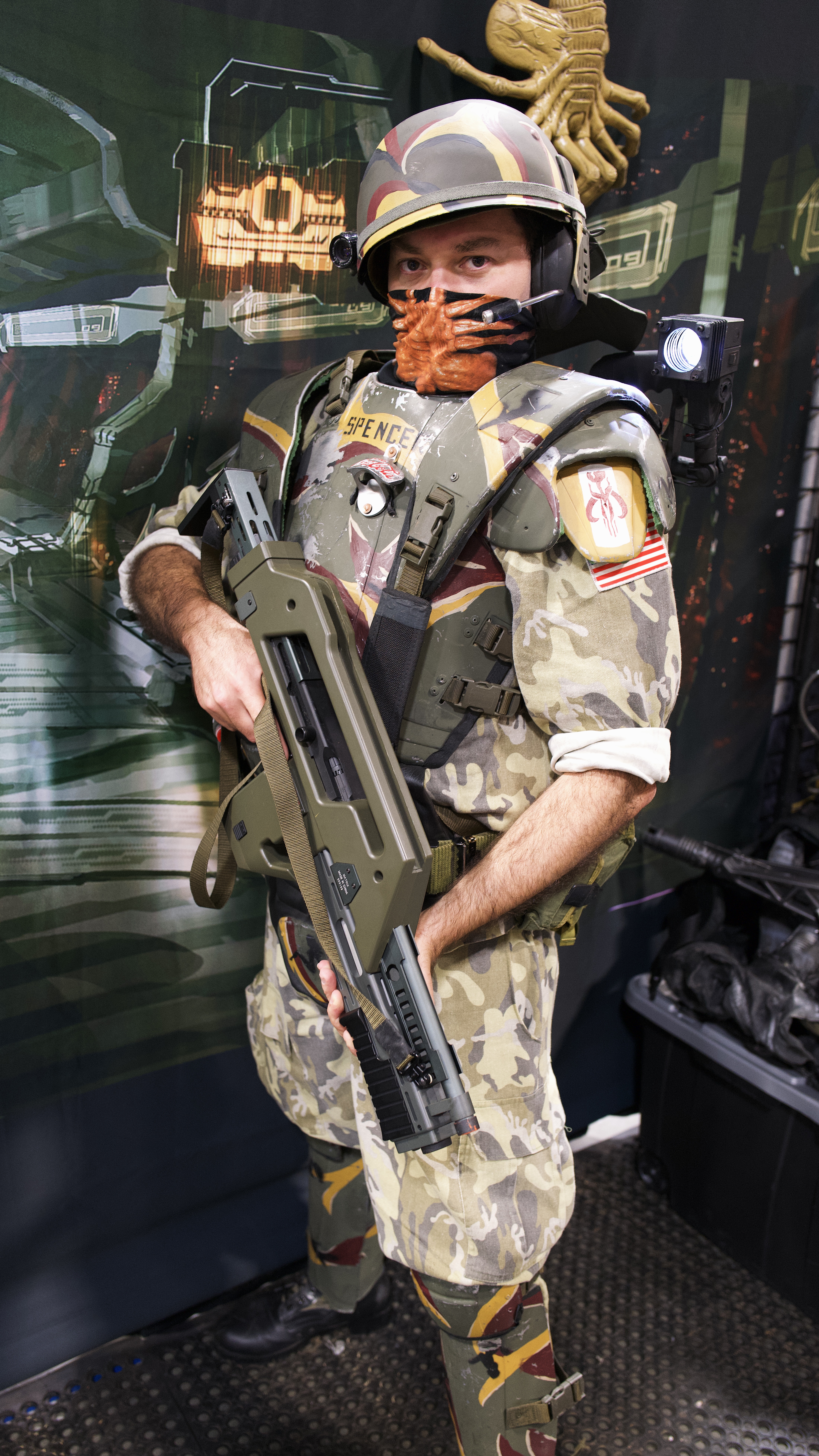 A Warhammer 40,000 Space Marine cosplayer in full power armor at a fan convention