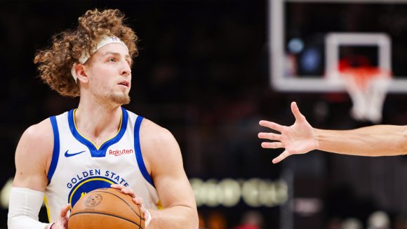 Brandin Podziemski in a Golden State Warriors uniform during a game.