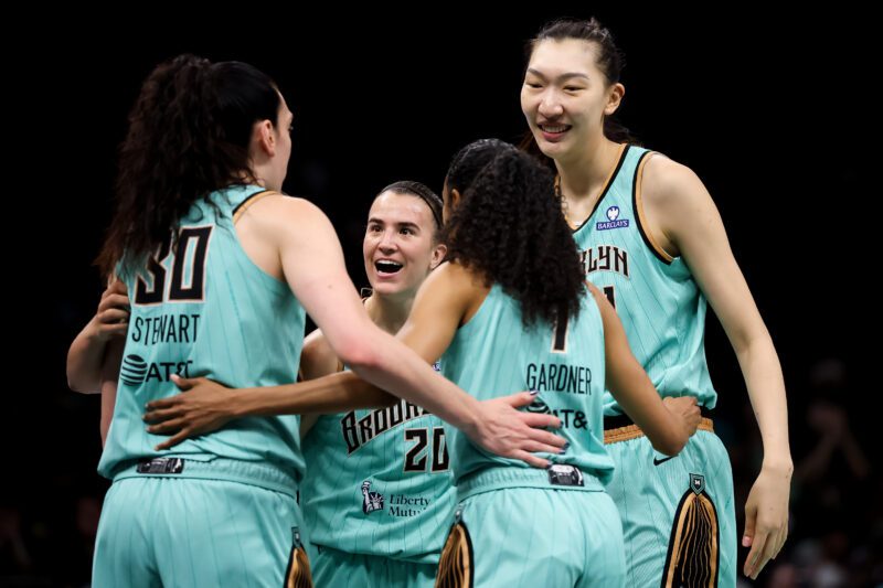 New York Liberty players celebrate during a 2026 WNBA game
