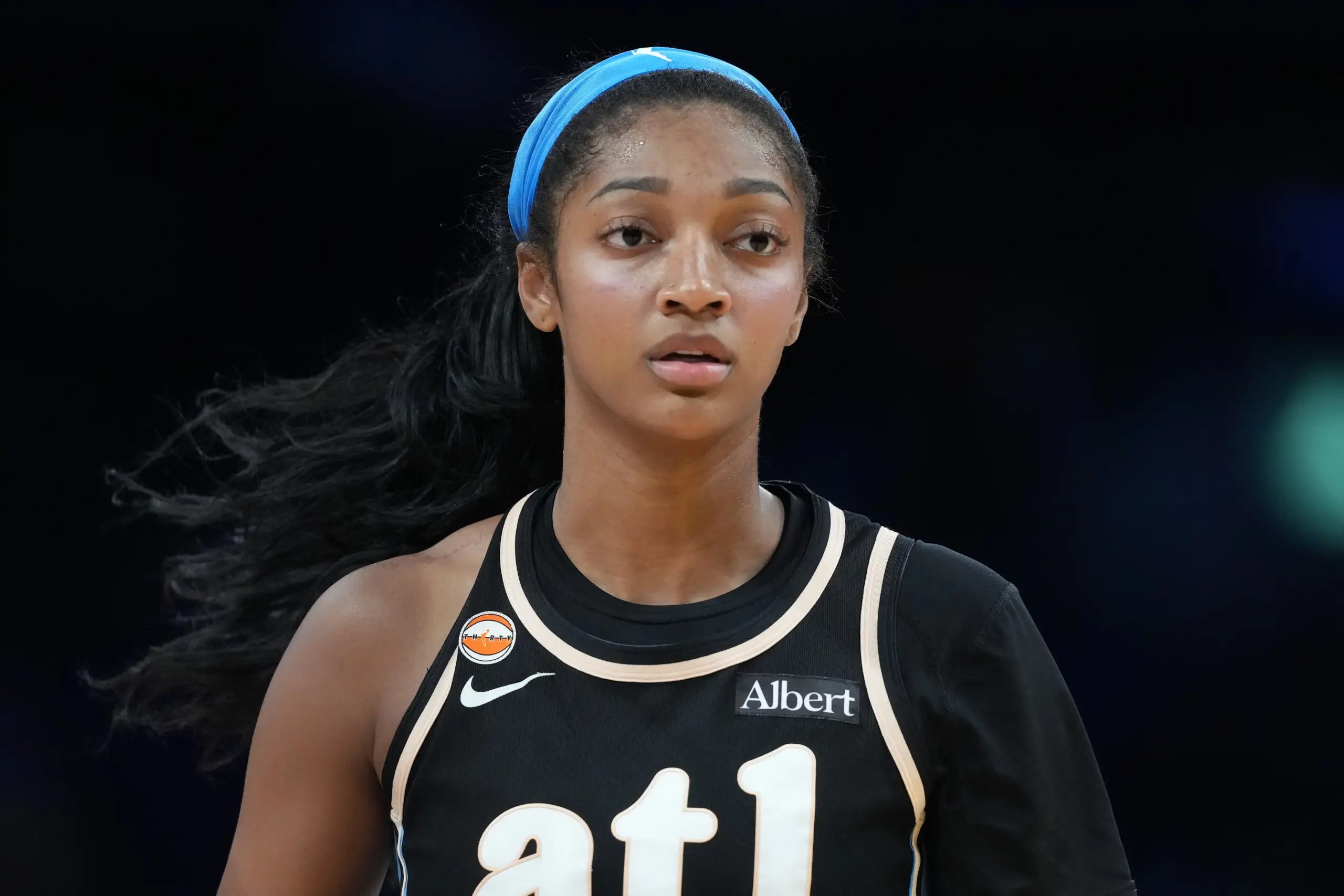 Atlanta Dream forward Angel Reese reacting during a WNBA game.
