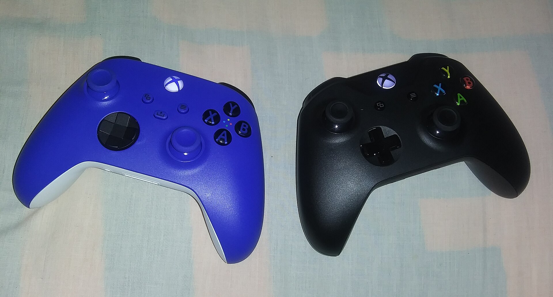 Xbox wireless controllers in blue and black