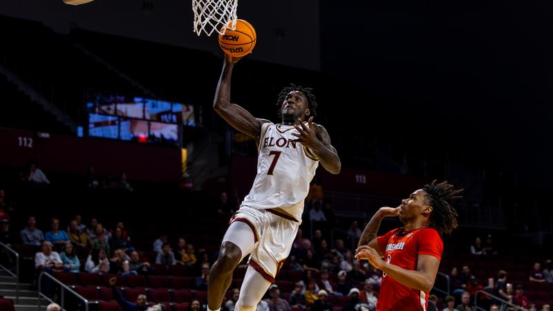 Elon Phoenix men's basketball in action at the Schar Center