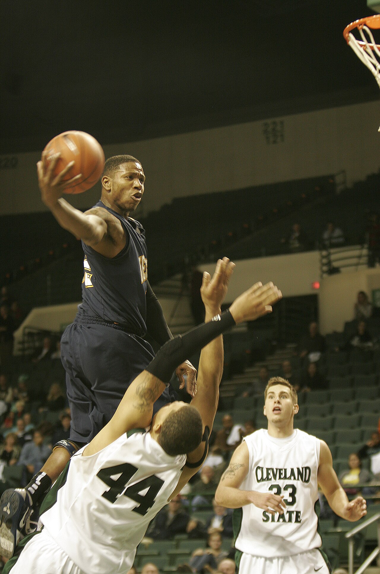 Kent State men's basketball player driving to the basket against Cleveland State