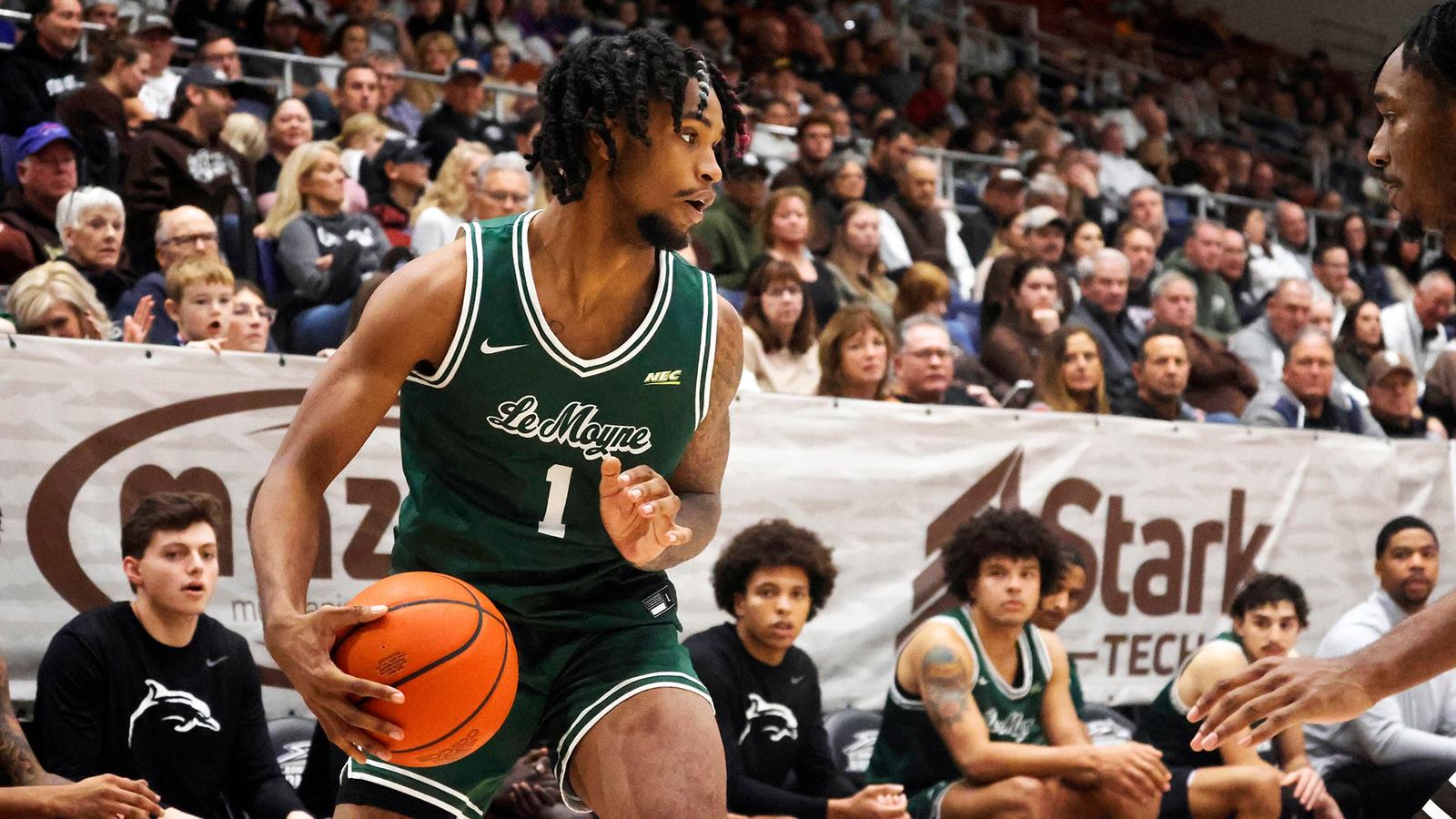 Le Moyne Dolphins guard Dwayne Jones Jr. handles the ball in game action