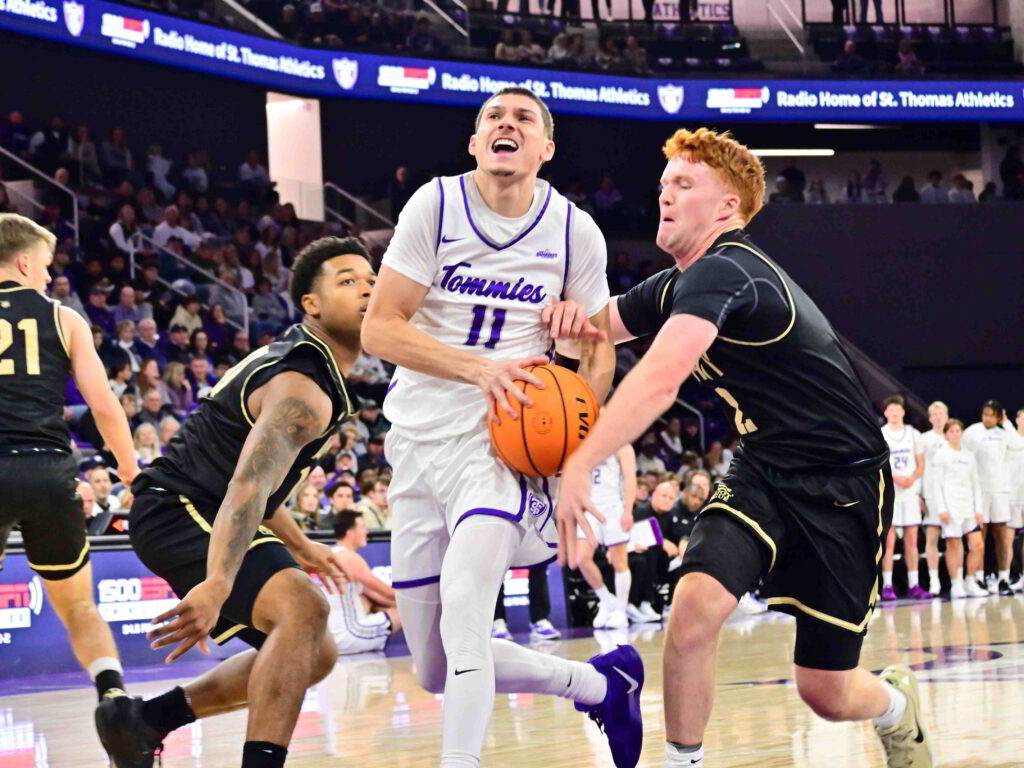 St. Thomas Tommies guard drives to the basket at Lee & Penny Anderson Arena