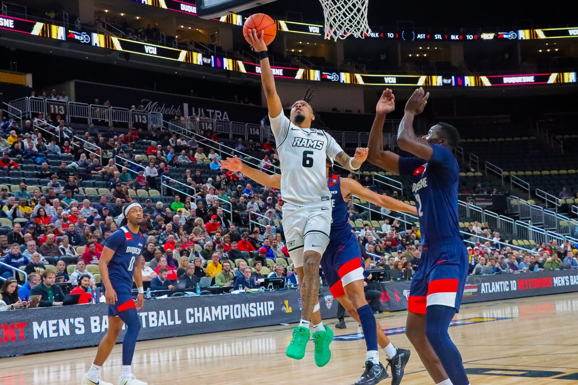 A VCU guard attacks the rim against Duquesne in the 2026 Atlantic 10 tournament