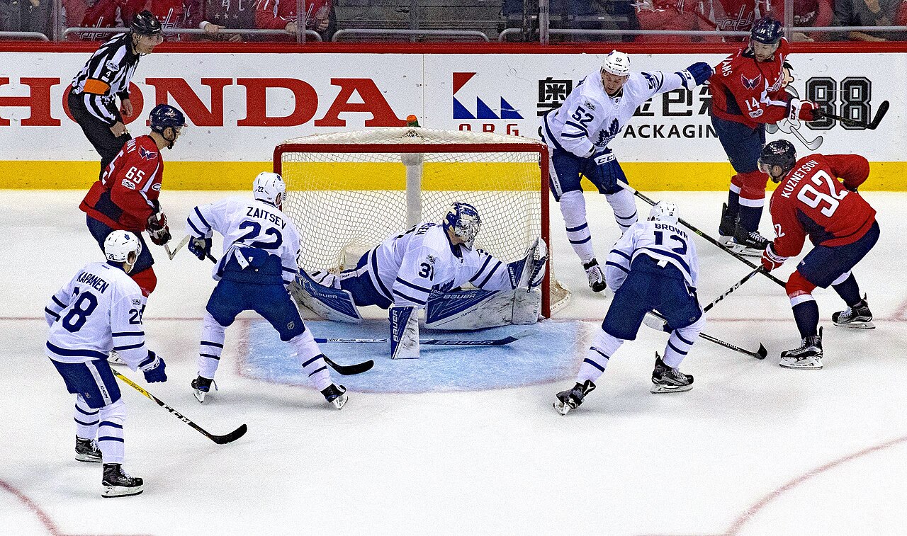 Washington Capitals players battle in front of the net during NHL action